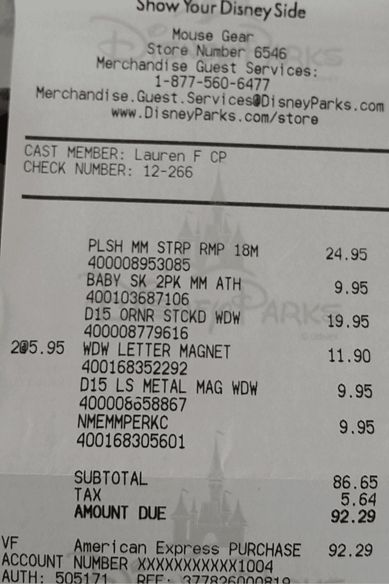 Retail store receipt photo showing merchant name, line items, prices, tax, and total